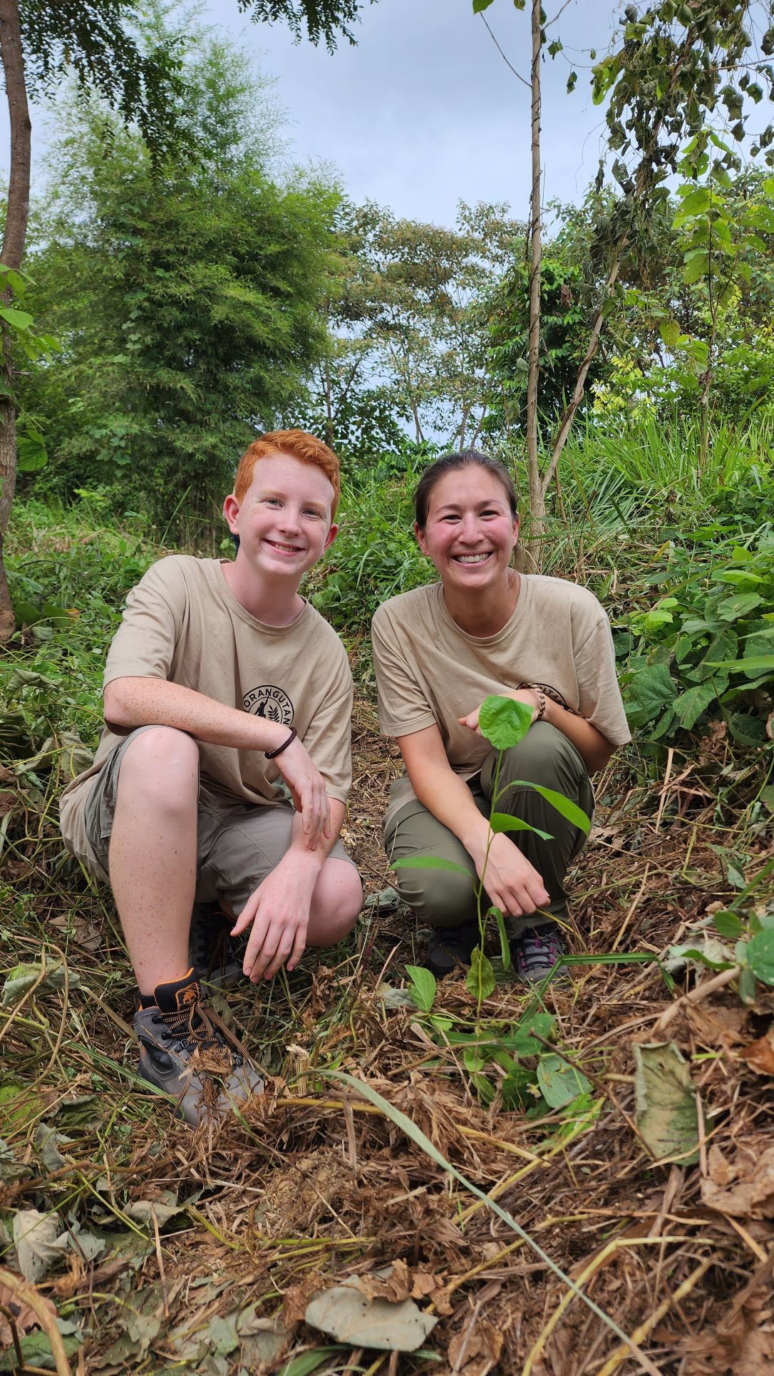 Jack and Lexi plant trees